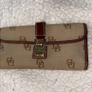 EUC Dooney & Bourke Tan Wallet with push lock with non descriptive dust bag.
